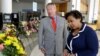 Orlando Mayor Buddy Dyer, left, and Attorney General Loretta Lynch view a memorial with 49 wreaths at City Hall, one wreath for each victim of the Pulse nightclub mass shooting in Orlando, Florida, June 21, 2016. 