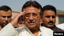 Pakistan's former President and head of the All Pakistan Muslim League (APML) political party Pervez Musharraf salutes as he arrives to unveil his party manifesto for the forthcoming general election at his residence in Islamabad April 15, 2013. 