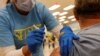 Nursing student Erika Lohr vaccinates a patient as California opens up vaccine eligibility to any residents 16 years and older during the outbreak of coronavirus disease, in Chula Vista, California, April 15, 2021. 