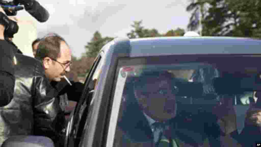 Syrian Information Minister Omran al-Zoubi leaves after meeting with the Syrian opposition at UN headquarters in Geneva, Jan. 27, 2014.