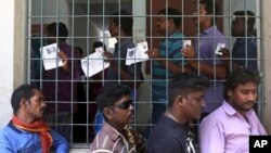 Indians stand in a queue to cast their votes during the second phase of India's general elections in Chennai, India, April 18, 2019. The Indian election is taking place in seven phases over six weeks in the country of 1.3 billion people. 