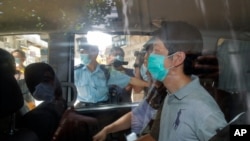 Pro-democracy legislator Ted Hui is arrested by police officers in Hong Kong, Aug. 26, 2020. 