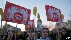 FILE - People take to the streets near Republique square to protest anti-Semitism, in Paris, France, Feb. 19, 2019. 