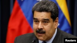 Venezuela's President Nicolas Maduro talks to the media during a news conference at Miraflores Palace in Caracas, Venezuela, September 18, 2018. REUTERS/Marco Bello - RC1B74050D60 