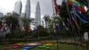 FILE - National flags and the Association of Southeast Asian Nations logo are on display ahead of an ASEAN summit in Kuala Lumpur, Malaysia, Nov. 18, 2015. 