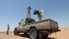 FILE - Libyan forces allied with the U.N.-backed government patrol to prevent Islamic State resurgence on the outskirts of Sirte, Libya, Aug. 4, 2017. 