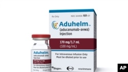 FILE - This image provided by Biogen, June 7, 2021, shows a vial and packaging for the drug Aduhelm.