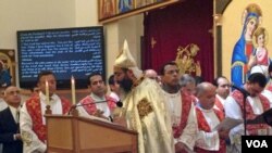 Father Bishoy Andrawes leads a Christmas celebration at the St. Mark Orthodox Church in Fairfax, Virginia on January 6, 2013. (Mohamed Elshinnawi)