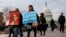 FILE - People march in support of the Deferred Action for Childhood Arrivals (DACA) and Temporary Protected Status (TPS) programs, Dec. 5, 2017, on Capitol Hill in Washington. 