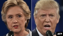 FILE - Democratic presidential candidate Hillary Clinton and Republican presidential candidate Donald Trump are shown during the second presidential debate at Washington University in St. Louis, Mo., Oct. 9, 2016.