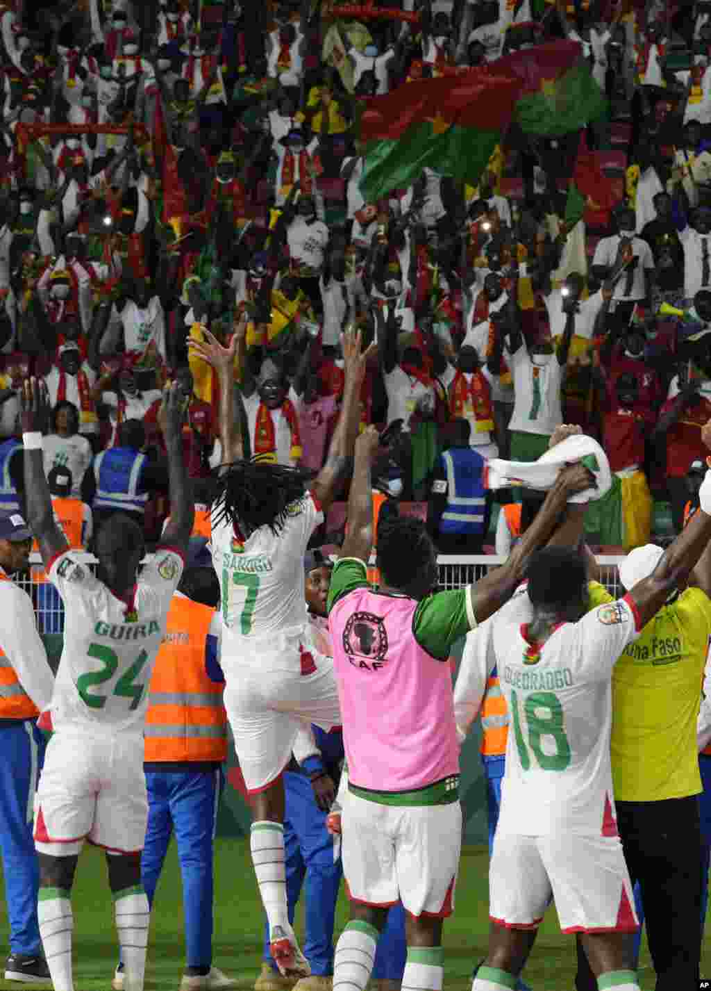 Burkina Faso&#39;s players celebrate with supporters after winning the match against Cape Verde, Jan. 13, 2022.