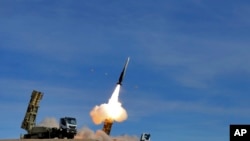 FILE - In this photo provided Nov. 5, 2018, by the Iranian Army, a Sayyad 2 missile is fired by the Talash air defense system during drills in an undisclosed location in Iran.