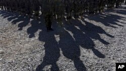 FILE - Members of Afghan special forces attend a ceremony on the outskirts of Kabul, Afghanistan, Oct. 25, 2017. Human Rights Watch alleges that CIA-trained paramilitary forces operate outside of the regular chain of commmand in the country. 