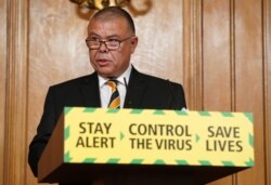A handout image released by 10 Downing Street, shows Britain's new Deputy Chief Medical Officer for England Jonathan Van-Tam speaking at a remote press conference, May 30, 2020.