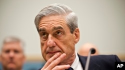FILE - Then-FBI Director Robert Mueller testifies on Capitol Hill in Washington, June 13, 2013.