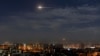 In this photo released by the Syrian official news agency SANA, shows missiles flying into the sky near international airport, in Damascus, Syria, Jan. 21, 2019