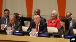 FILE - U.S. President Donald Trump, center, speaks while U.N. Secretary-General Antonio Guterres, left, and U.S. Ambassador to the United Nations Nikki Haley look on, at U.N. headquarters, Sept. 18, 2017.