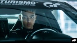This image released by Columbia Pictures shows Archie Madekwe in a scene from "Gran Turismo"