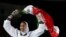 FILE - Kimia Alizadeh Zenoorin of Iran celebrates after winning the bronze medal in a women's Taekwondo 57-kgcompetition at the 2016 Summer Olympics in Rio de Janeiro, Brazil, Aug. 18, 2016.