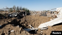 აფეთქების ადგილი ქალაქ ჰილაში, ერაყის სამხედრო პოზიციებზე აშშ-ის საჰაერო იერიშის შემდეგ. 26 დეკემბერი, 2023 წ.