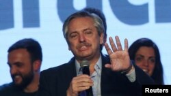 Presidential candidate Alberto Fernandez speaks during the primary elections, at a cultural center in Buenos Aires, Argentina, Aug. 11, 2019.