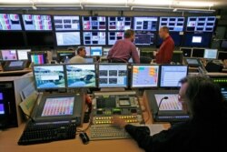 FILE - An operator works in the master room of the European Broadcast Union (EBU) in Geneva, Nov. 13, 2007.