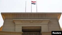 FILE - The Egyptian flag is seen atop the Supreme Constitutional Court building in Cairo in this July 4, 2013, file photo.