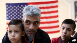 Syrian refugee Nadim Fawzi Jouriyeh, 49, speaks to reporters at the Amman, Jordan office of the International Organization for Migration, Aug. 28, 2016.