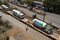 Oxygen tankers are seen on a special "Oxygen Express" train upon their arrival at a goods yard amid the coronavirus pandemic in Navi Mumbai, April 26, 2021.