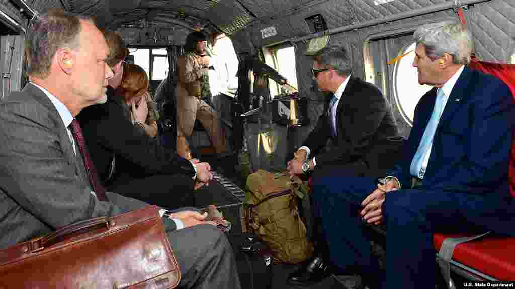 FILE - US Secretary of State John Kerry rides in a helicopter en route to the US Embassy in Kabul upon arriving in Afghanistan in August, 2014.