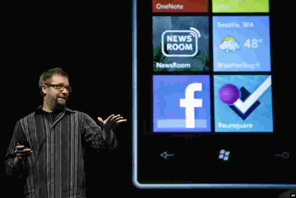 Aaron Woodman, Microsoft's director of their Mobile Communications Business, talks about the Windows Phone 7 during Microsoft Corp.'s shareholders meeting, Nov. 16, 2010, in Bellevue, Washington.