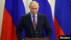 Russian President Vladimir Putin speaks during a news conference in Sochi, Russia, Dec. 8, 2021. 