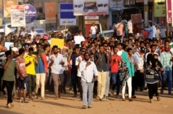 Sudanese demonstrators march during a protest in the capital Khartoum, Oct. 21, 2019.
