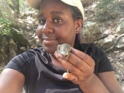 Black Birders Week is not just for birders. Earyn McGee poses with a Yarrow's spiny lizard. (Photo courtesy of Earyn McGee/Noel Hamideh)