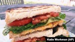 Pictured here is a grilled cheese sandwich with lettuce and tomato. For a sandwich, you need slices of bread that are the same size. (File Photo)