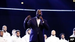 FILE- Magic Johnson speaks before the NBA All-Star basketball game, Feb. 16, 2020, in Chicago.