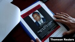 Eric Emeraux, head of the Gendarmerie's Central Office for Combating Crimes Against Humanity, Genocides and War Crimes, poses in Paris, Oct. 29, 2020.