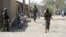 FILE - Nigerian soldiers are seen patrolling Baga, a town in the northeastern state of Borno, April 30, 2013.