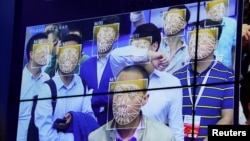 Visitors experience facial recognition technology at Face++ booth during the China Public Security Expo in Shenzhen, China October 30, 2017. 