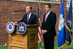 Connecticut Gov. Ned Lamont, left, speaks as New York Gov. Andrew Cuomo listens during a press conference, Sept. 25, 2019, in Hartford, Conn.