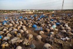 FILE - An aerial shows an internally displaced persons camp in Faladie, Mali, where nearly 800 IDPs have found refuge after fleeing intercommunal violence, on May 14, 2019.