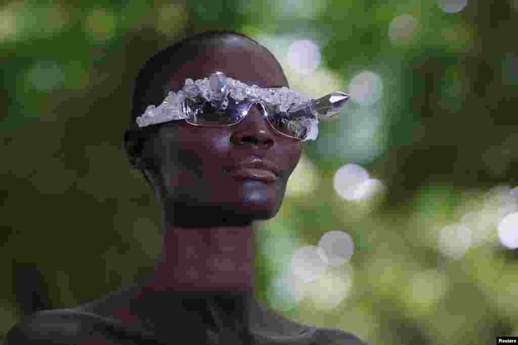 A model presents a creation by Bulgarian designers Livia Stoianova and Yassen Samouilov as part of the Haute Couture Fall/Winter 2014-2015 fashion show for fashion house On Aura Tout Vu in Paris, France.