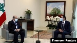 Lebanon's President Michel Aoun meets with Prime Minister-designate Saad al-Hariri at the presidential palace in Baabda, Lebanon, March 18, 2021. (Dalati Nohra/Handout via Reuters)