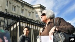 Judy Gross, wife of Alan Gross, an American imprisoned in Cuba, right, at a rally to support her husband outside the Cuban Interests Section in Washington, Monday, Nov. 28, 2011.