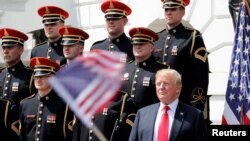 U.S. President Donald Trump participates in a "celebration of the American flag" event on the South Lawn of the White House in Washington, June 5, 2018.