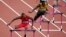 Michael Tinsley of the U.S. (L) and Jamaica's Leford Green clear hurdles during the men's 400m hurdles in London in 2012. 