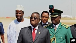 Ghana's President John Atta Mills (front, C) is up for re-election in the upcoming December vote (file photo). 