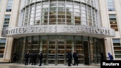 FILE - Police guard the courthouse of United States District Court for the Eastern District of New York, site of the trial of Joaquin "El Chapo" Guzman, in Brooklyn, New York, Nov. 5, 2018. 