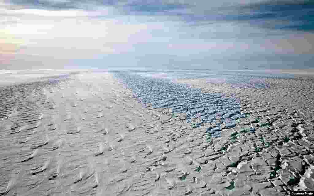 Koji Kubota of the Japan Coast Guard keeps watch while flying in the search zone for debris from flight MH370, April 1, 2014.