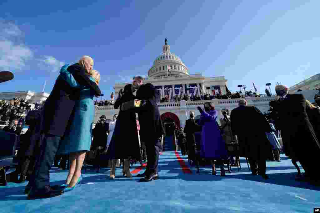President Joe Biden hugs first lady Jill Biden, as his son Hunter Biden and daughter Ashley Biden look on, after he was sworn-in during the 59th Presidential Inauguration at the U.S. Capitol in Washington.